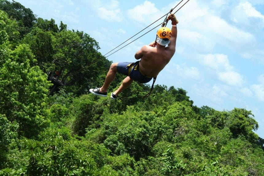 Boca Del Puma Cenote men on a Zipline 