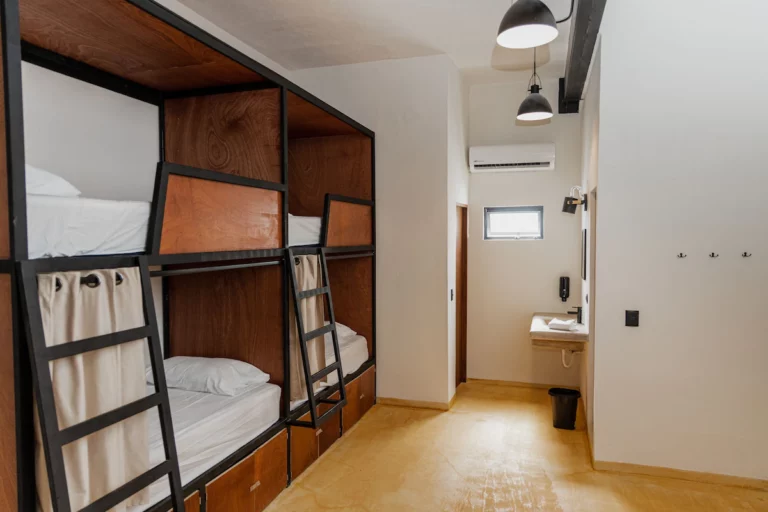 Caleta Hostel room with a couple of bunk beds.